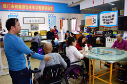 “輪椅跑者”謝啟明:用雙手“跑”出人生自信